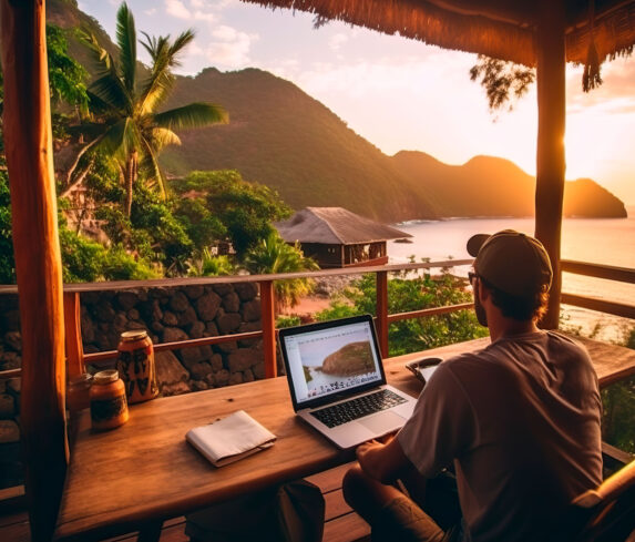Sitting-at-a-table-with-a-laptop-and-a-view-of-the-ocean_27291881